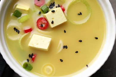 Photo of Bowl of delicious miso soup with tofu, top view