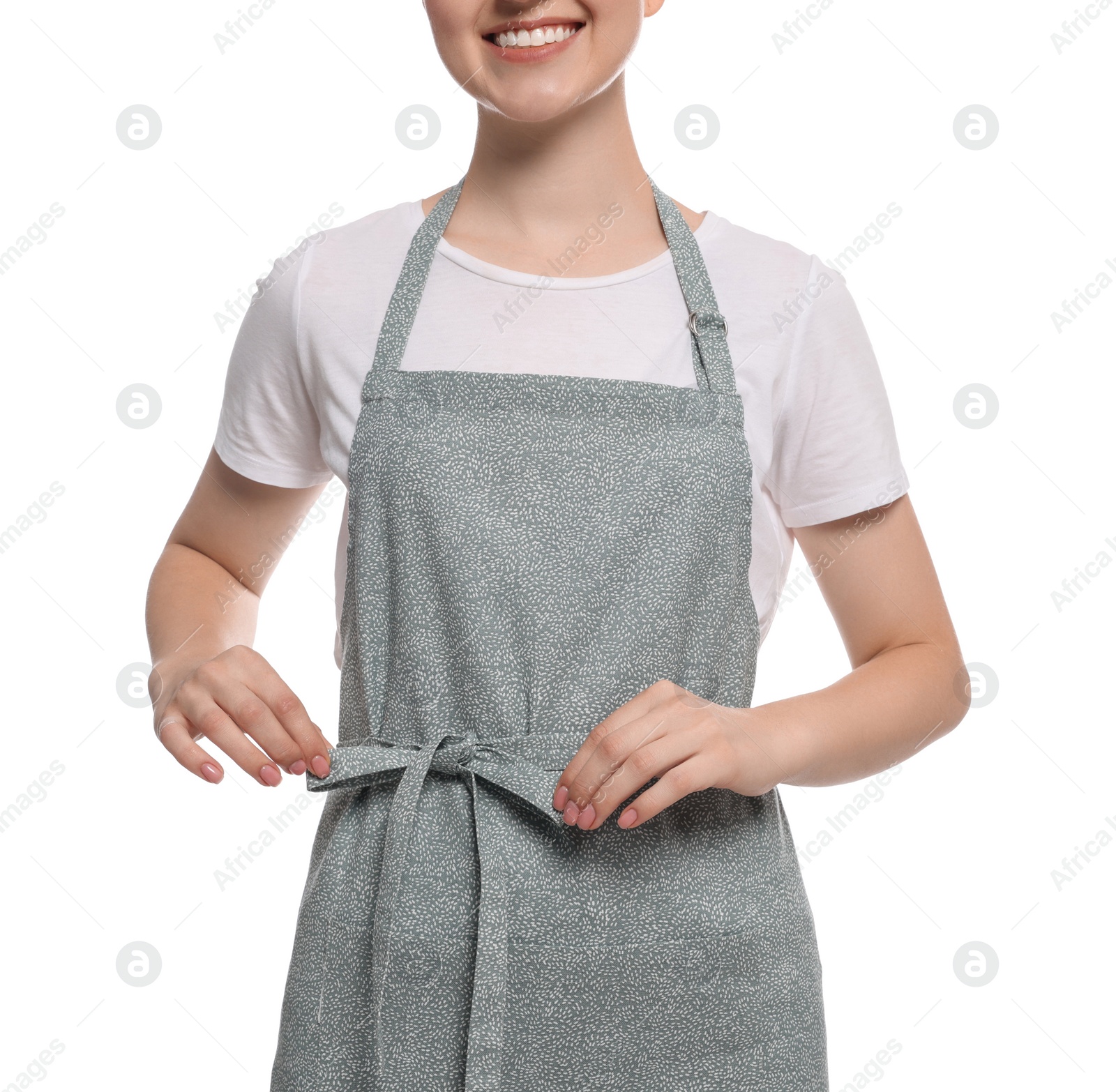 Photo of Woman in clean apron with pattern on white background, closeup