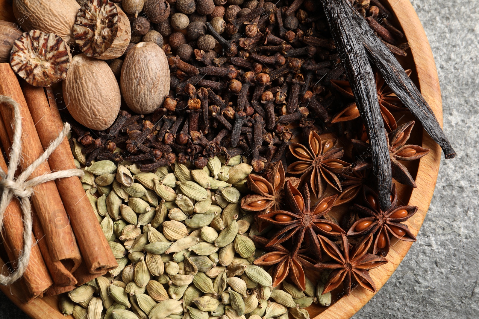 Photo of Different spices and nuts on table, top view