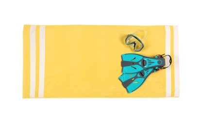 Photo of Yellow beach towel with diving equipment on light grey background, top view