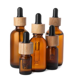 Photo of Different bottles of essential oil on white background