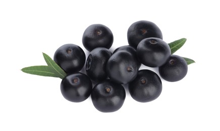 Photo of Pile of fresh ripe acai berries and green leaves on white background, top view