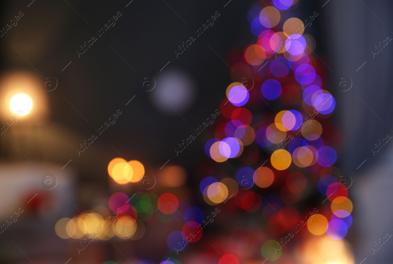 Photo of Blurred view of stylish room interior with decorated Christmas tree