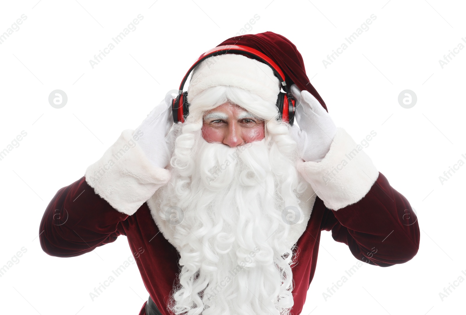 Photo of Santa Claus with headphones listening to Christmas music on white background