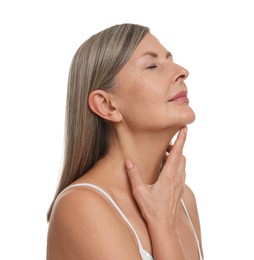 Beautiful woman touching her neck on white background