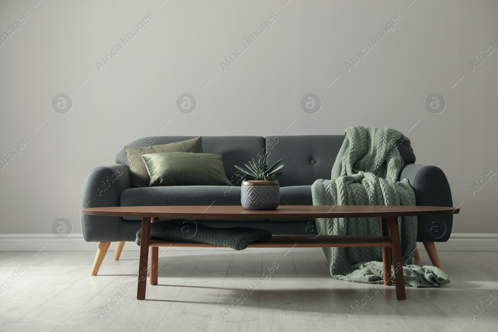 Photo of Stylish comfortable sofa in room. Interior design