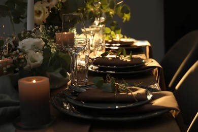Photo of Festive table setting with beautiful floral decor indoors