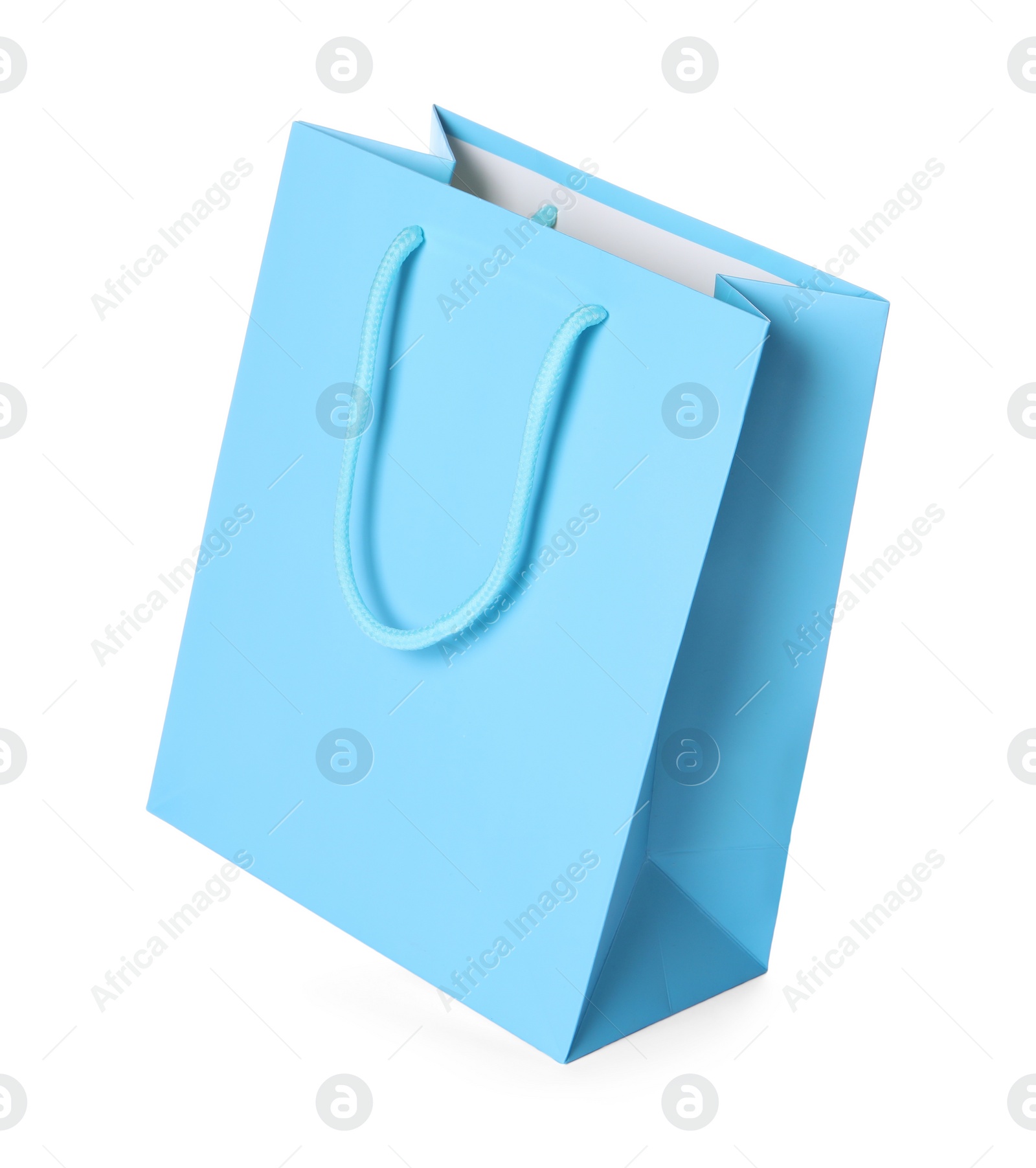 Photo of One light blue shopping bag isolated on white