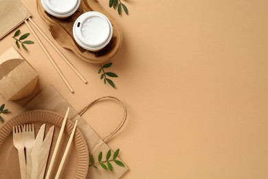 Photo of Flat lay of eco friendly products on beige background, space for text