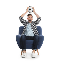 Photo of Handsome young man sitting in armchair and watching soccer match on white background