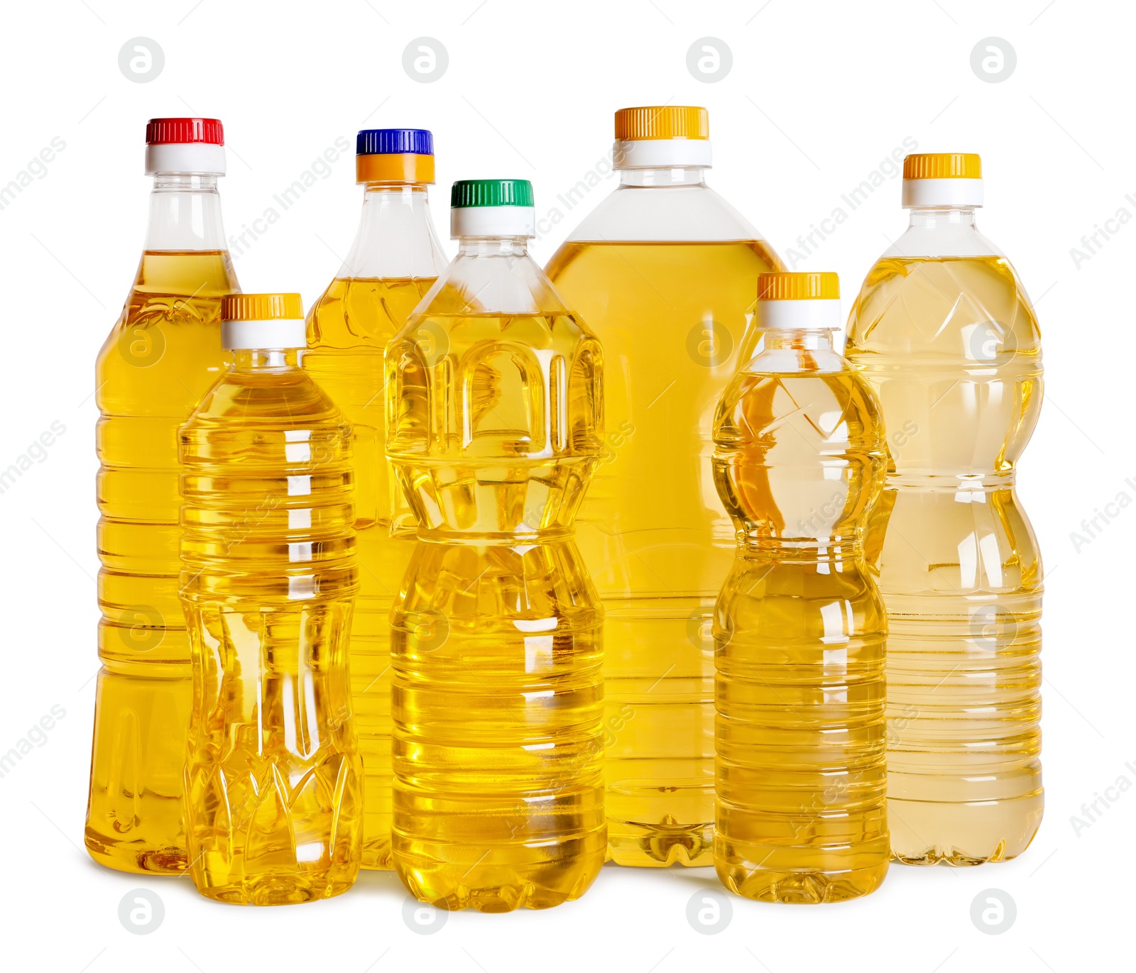 Photo of Bottles of cooking oil on white background