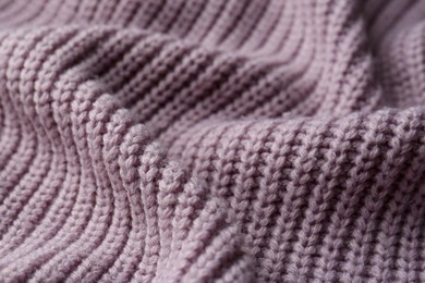 Photo of Beautiful violet knitted fabric as background, closeup