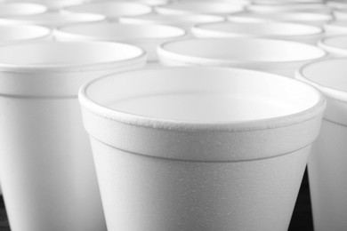 Photo of Closeup view of many white styrofoam cups