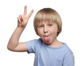 Photo of Cute little boy showing his tongue and v-sign on white background