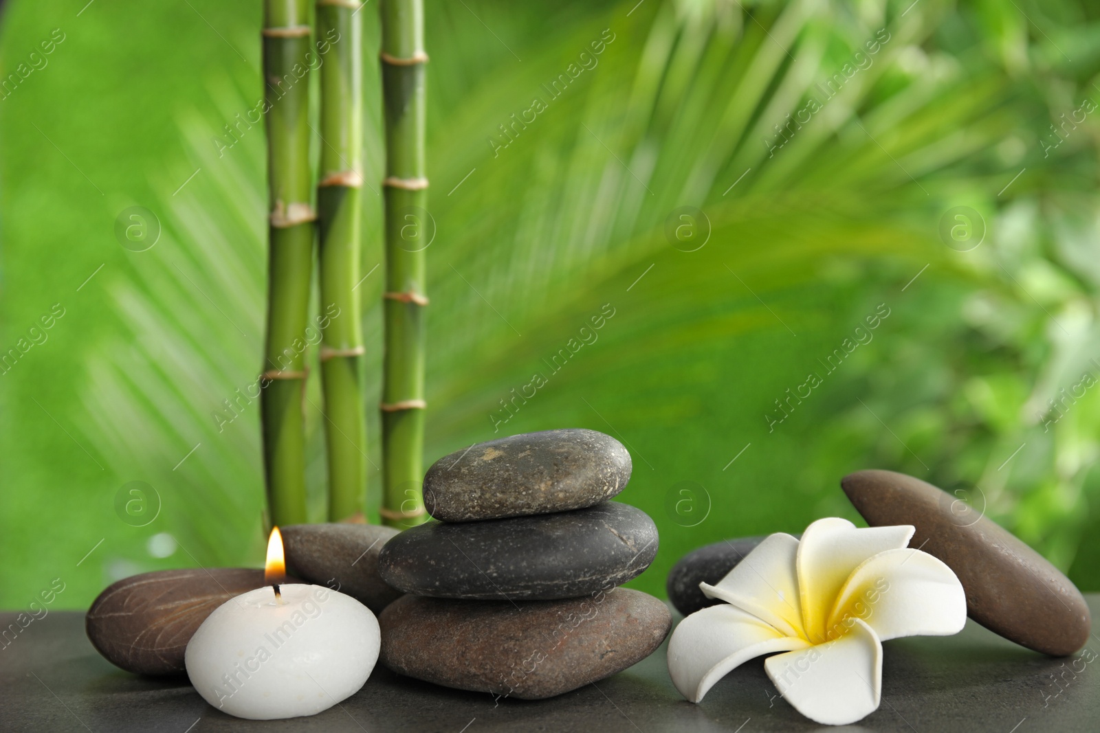 Photo of Composition with stones on table against blurred background. Zen concept