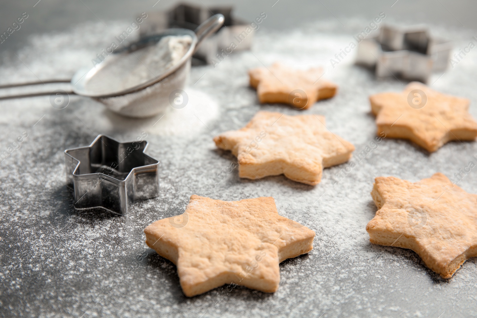 Photo of Tasty homemade Christmas cookies and flour on table