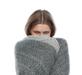 Photo of Young woman wrapped in warm blanket suffering from cold on white background