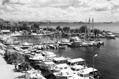 Beautiful view of modern boats at pier. Black and white tone