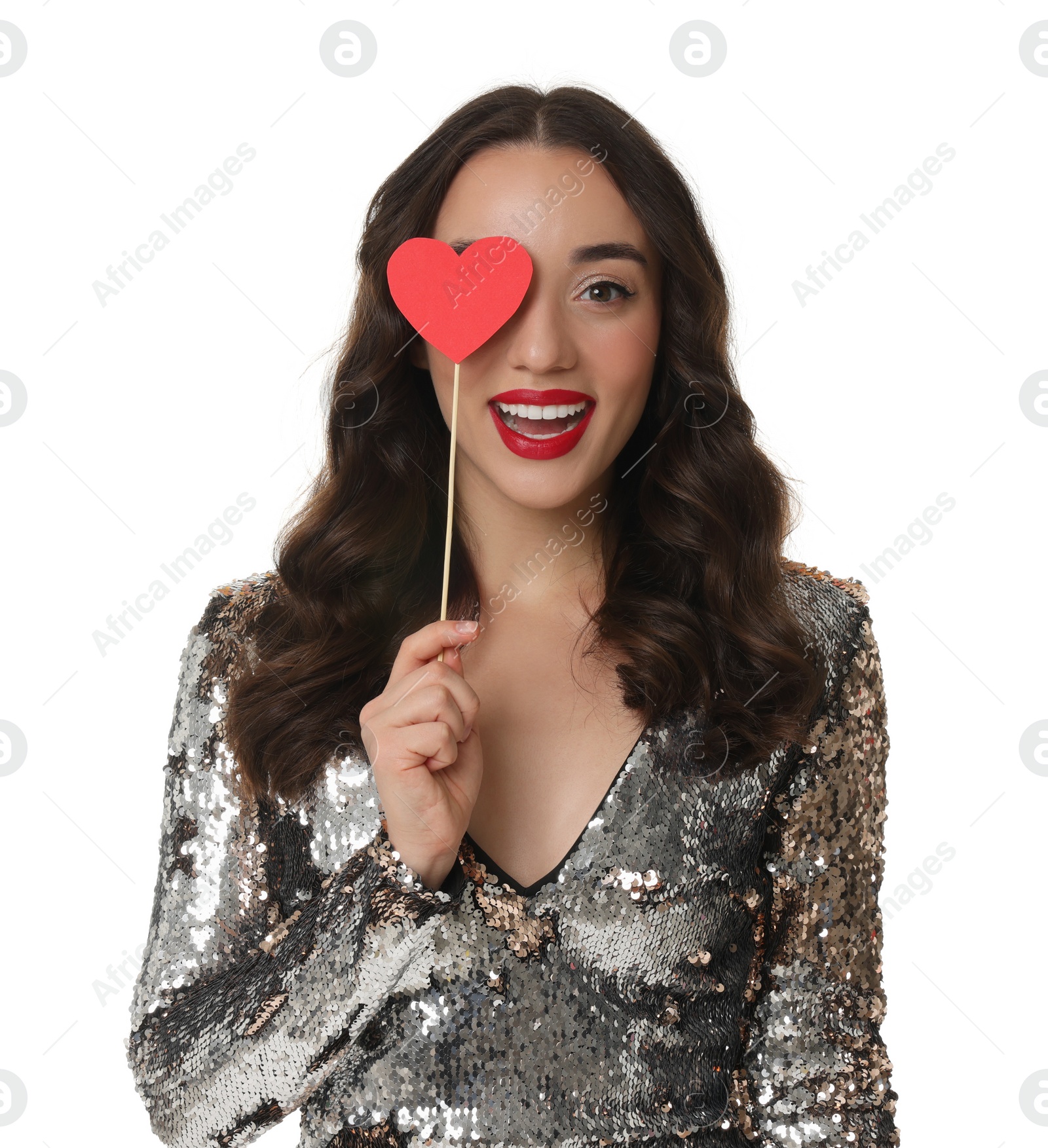 Photo of Beautiful young woman covering her eye with paper heart isolated on white