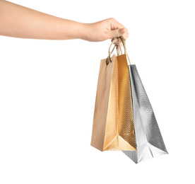 Photo of Woman holding paper shopping bags on white background, closeup