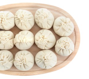 Photo of Board with uncooked khinkali (dumplings) isolated on white, top view. Georgian cuisine