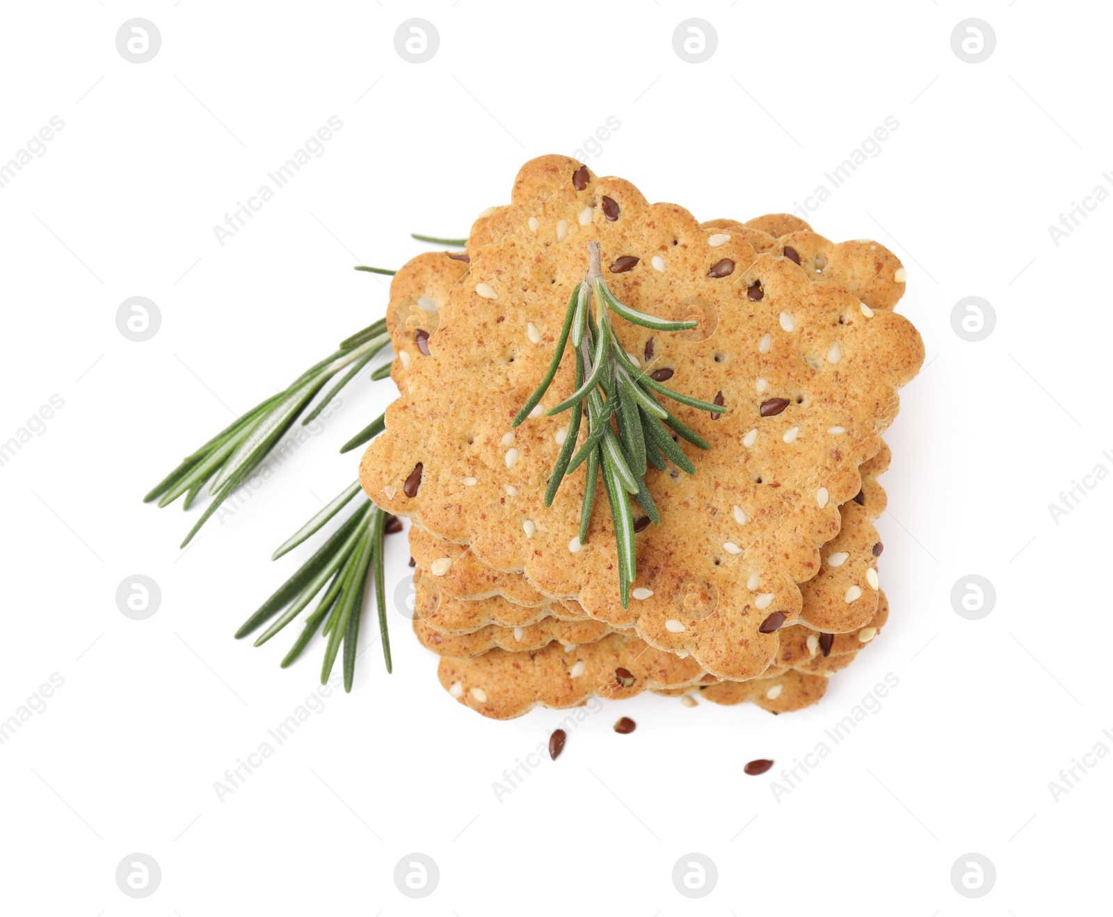 Photo of Stack of cereal crackers with flax, sesame seeds and rosemary isolated on white, top view