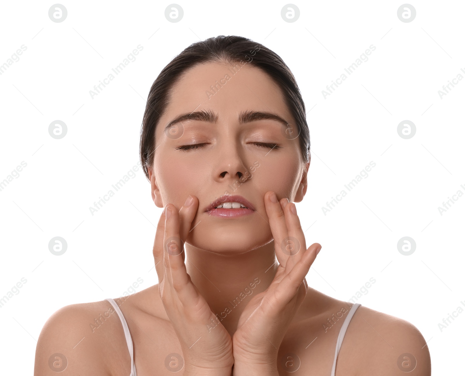 Photo of Young woman massaging her face on white background