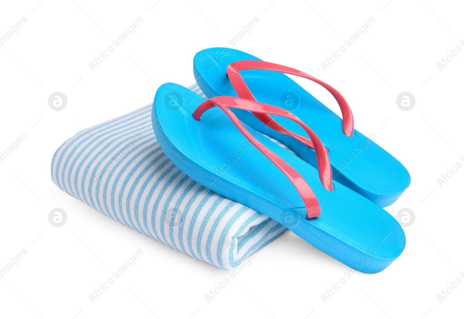 Photo of Stylish flip flops and beach towel isolated on white