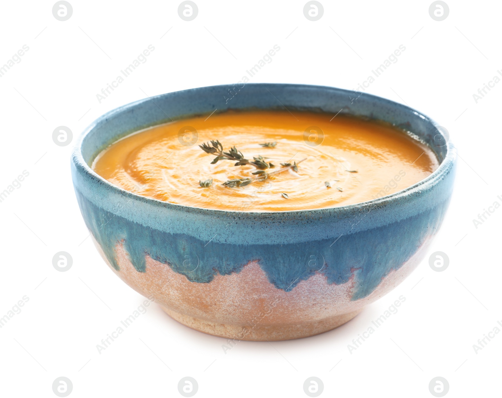 Photo of Delicious pumpkin cream soup in bowl on white background