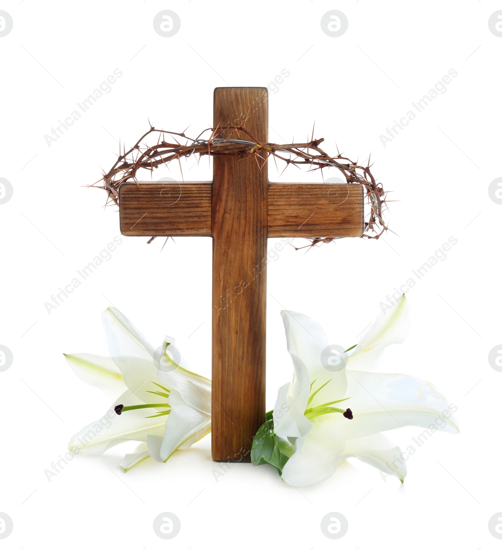 Photo of Wooden cross, crown of thorns and blossom lilies on white background