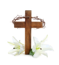 Photo of Wooden cross, crown of thorns and blossom lilies on white background