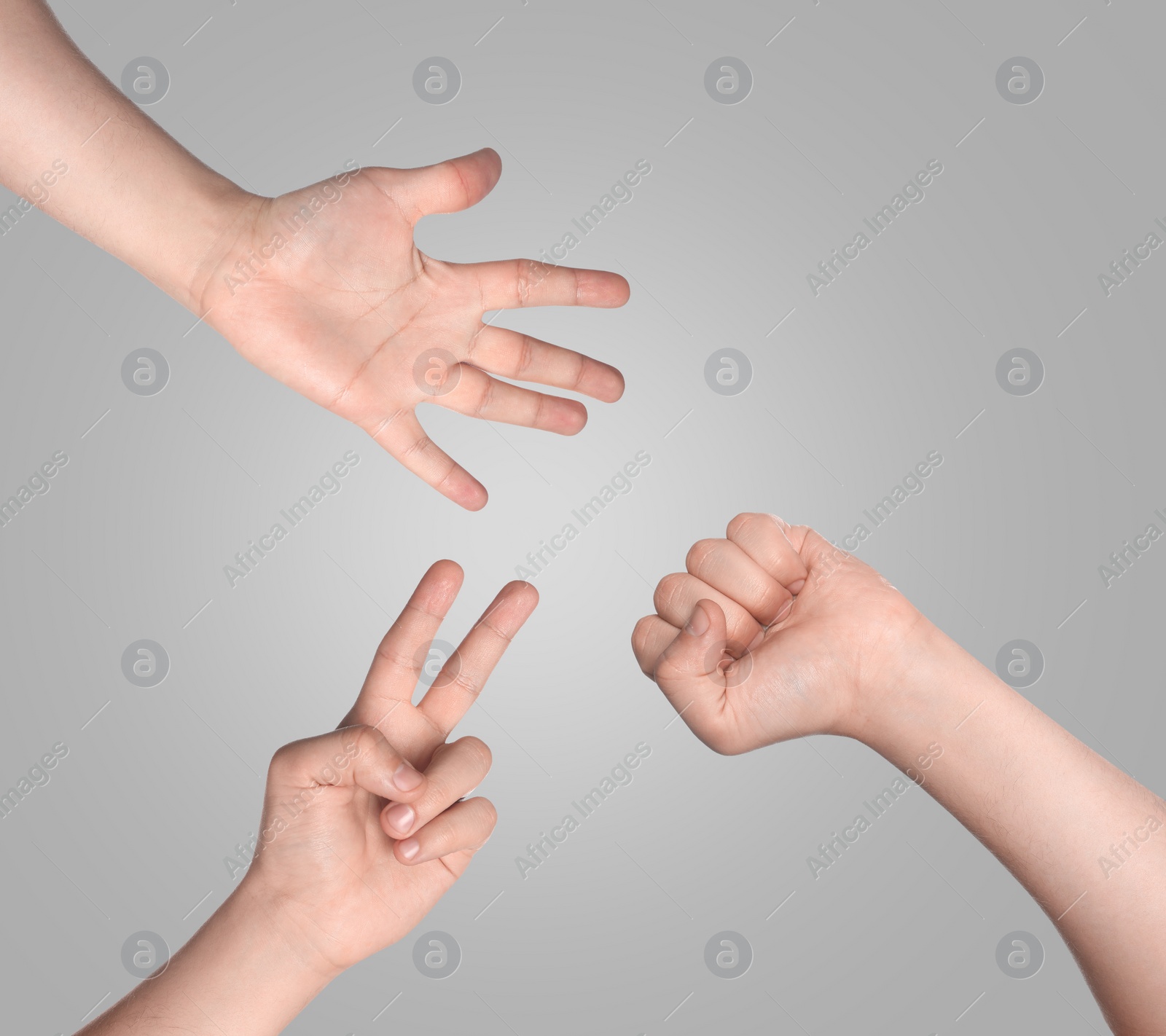 Image of People playing rock, paper and scissors on grey background, top view