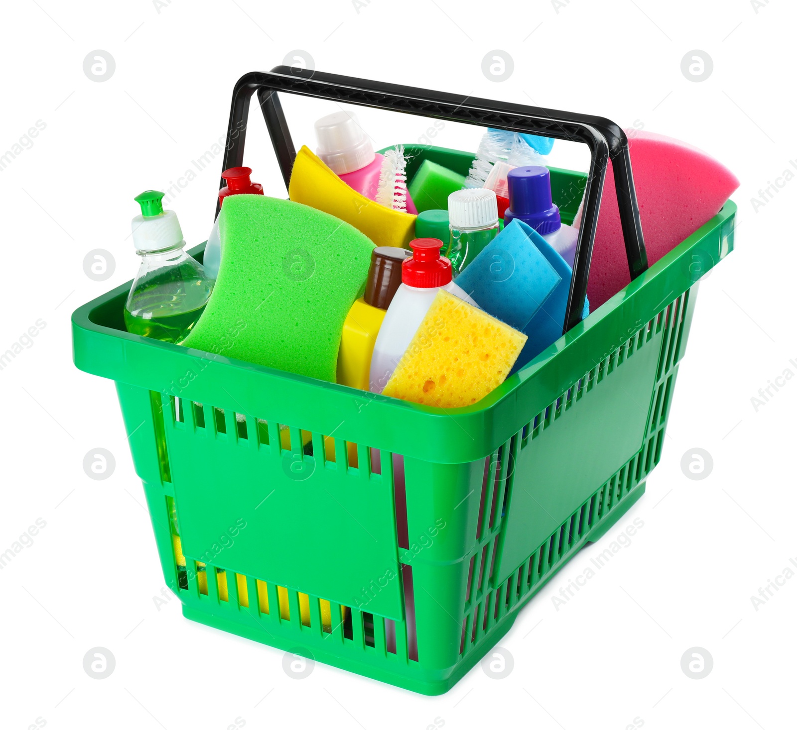 Photo of Green shopping basket with different household chemicals on white background