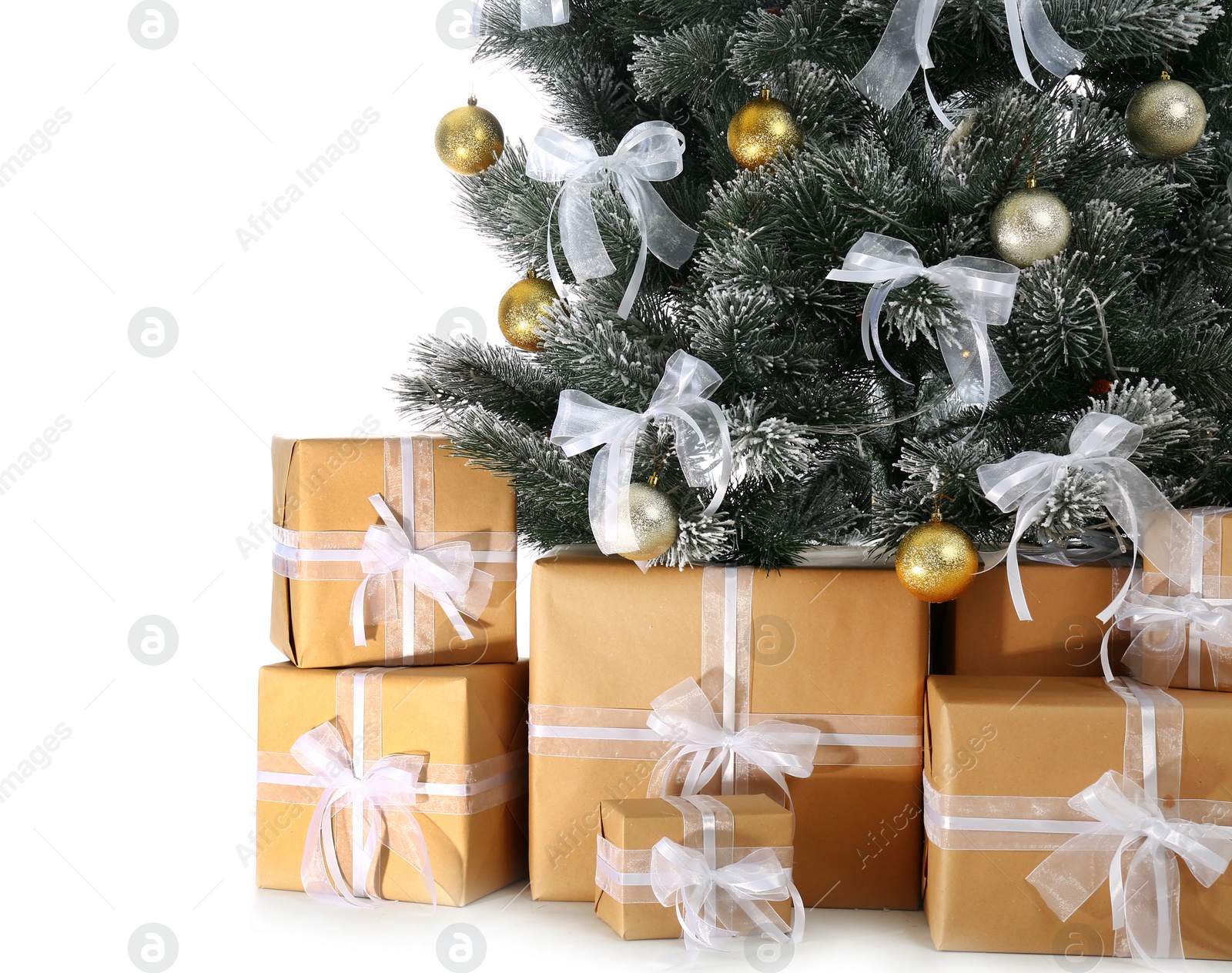 Image of Beautifully decorated Christmas tree and gifts on white background, closeup