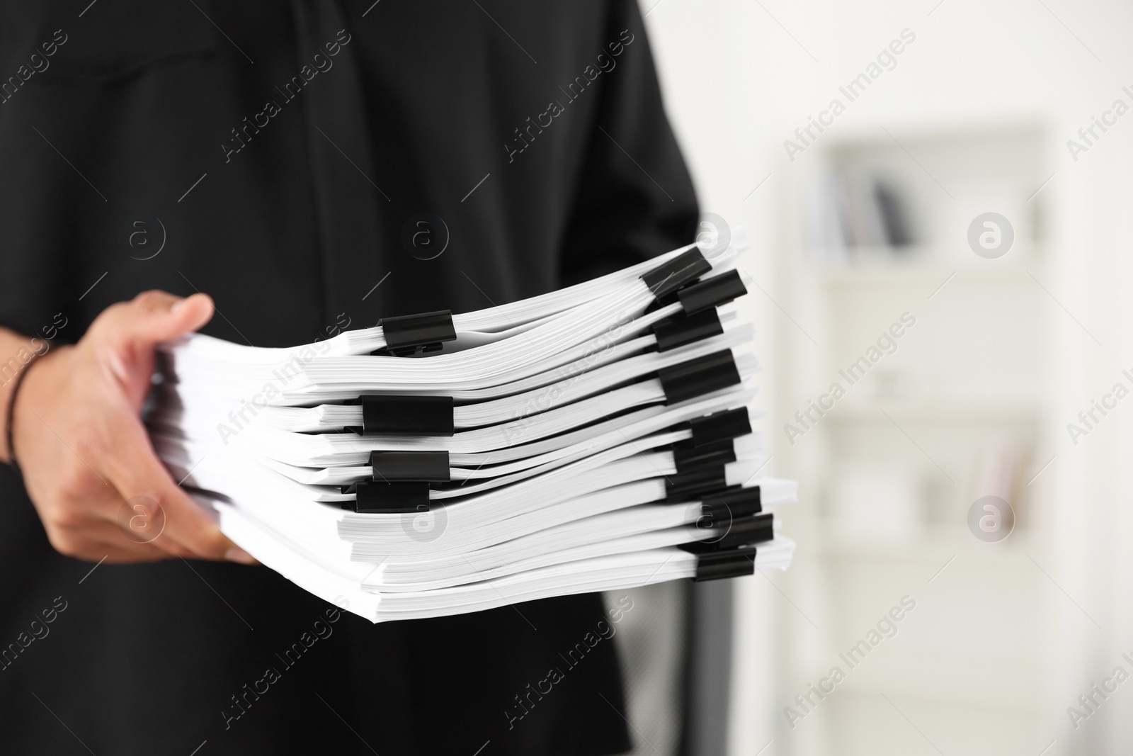 Photo of Businessman with documents in office, closeup view