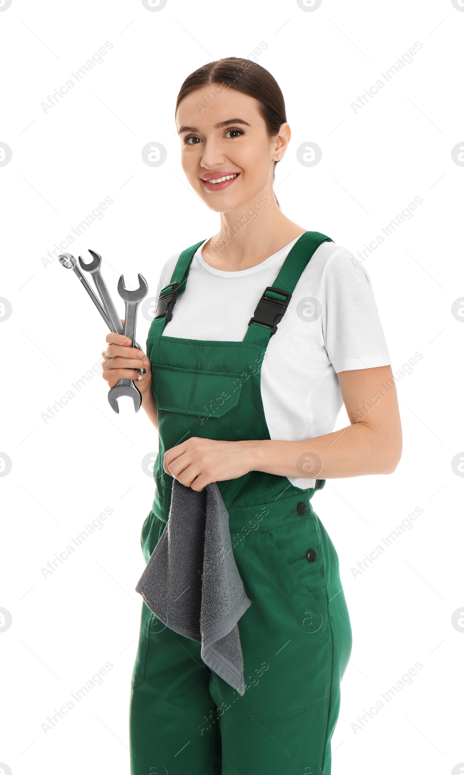 Photo of Portrait of professional auto mechanic with wrenches and rag on white background