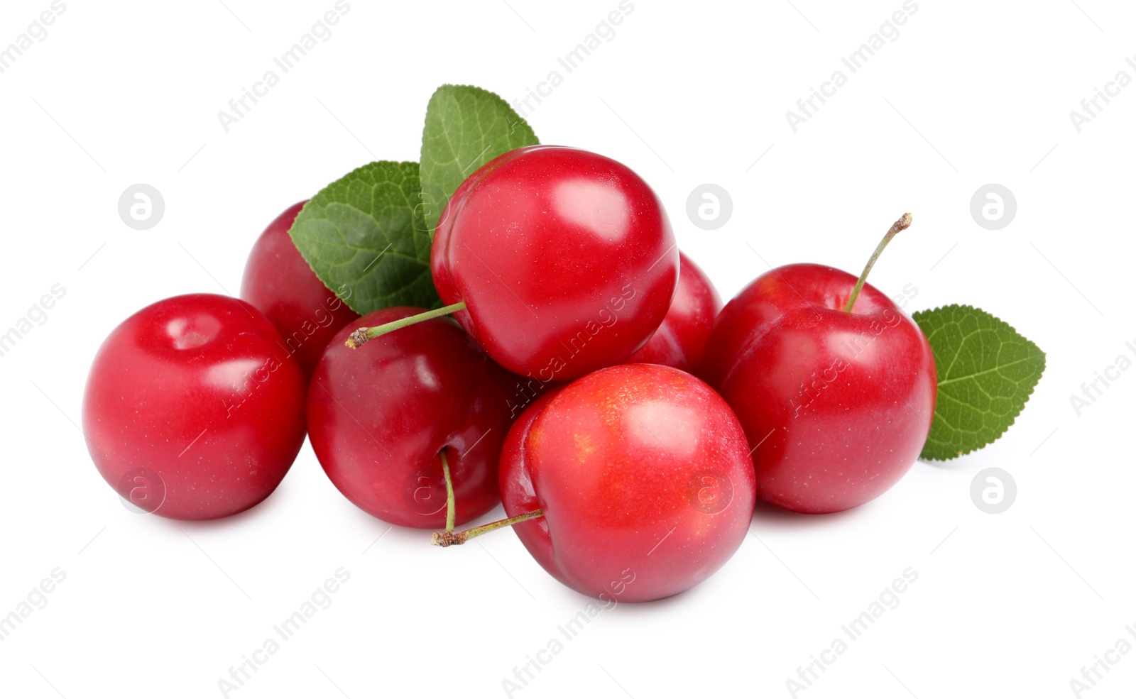 Photo of Delicious ripe cherry plums with leaves on white background