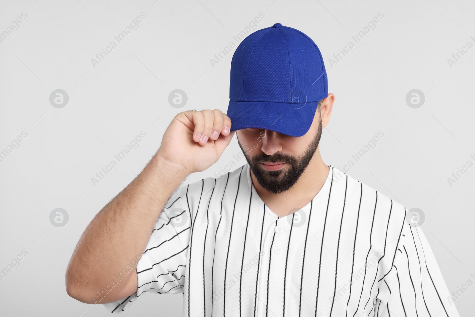 Photo of Man in stylish blue baseball cap on white background