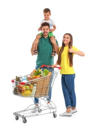 Happy family with full shopping cart on white background