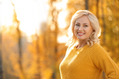 Photo of Portrait of happy mature woman in park on sunny day