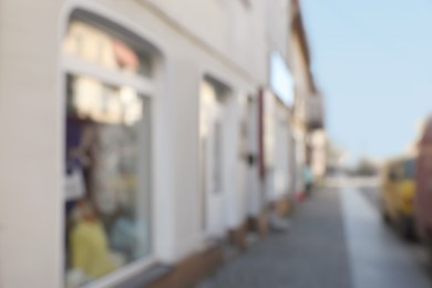 Blurred view of store exterior and city street. Bokeh effect