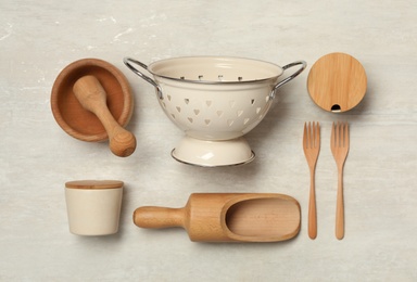 Photo of Set of cooking utensils on white table, flat lay