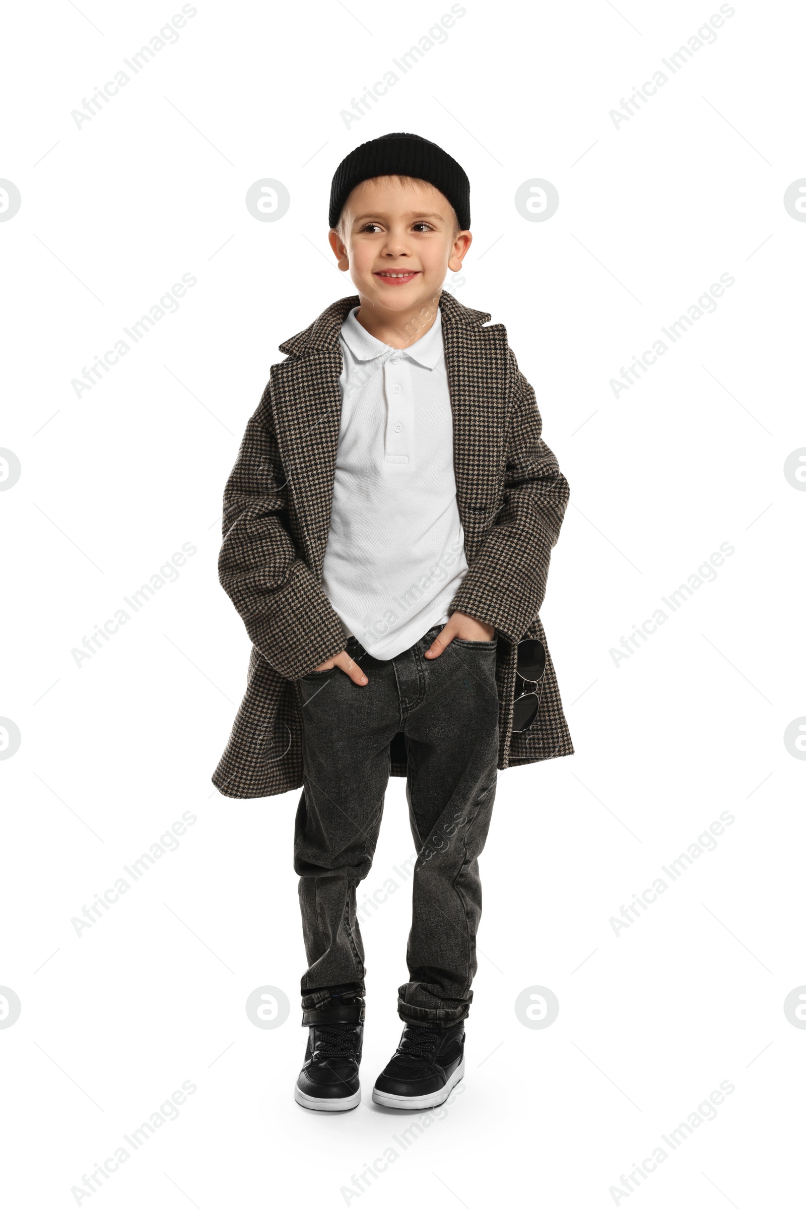 Photo of Fashion concept. Stylish boy posing on white background