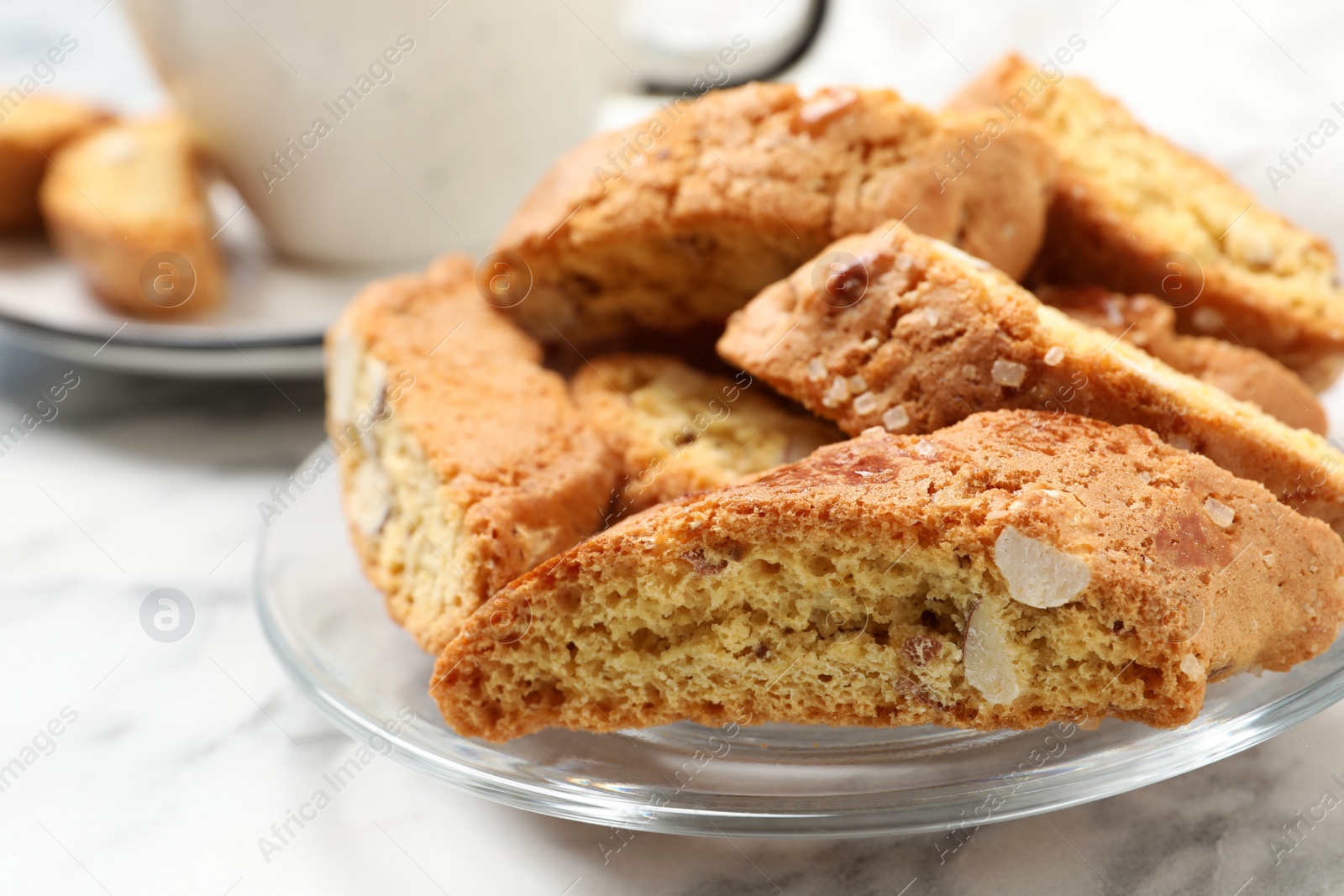 Photo of Traditional Italian almond biscuits (Cantucci) on white table, closeup