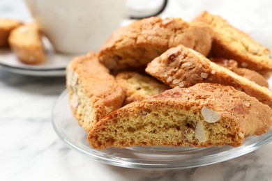 Photo of Traditional Italian almond biscuits (Cantucci) on white table, closeup