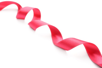 Photo of Simple pink ribbon on white background. Festive decoration