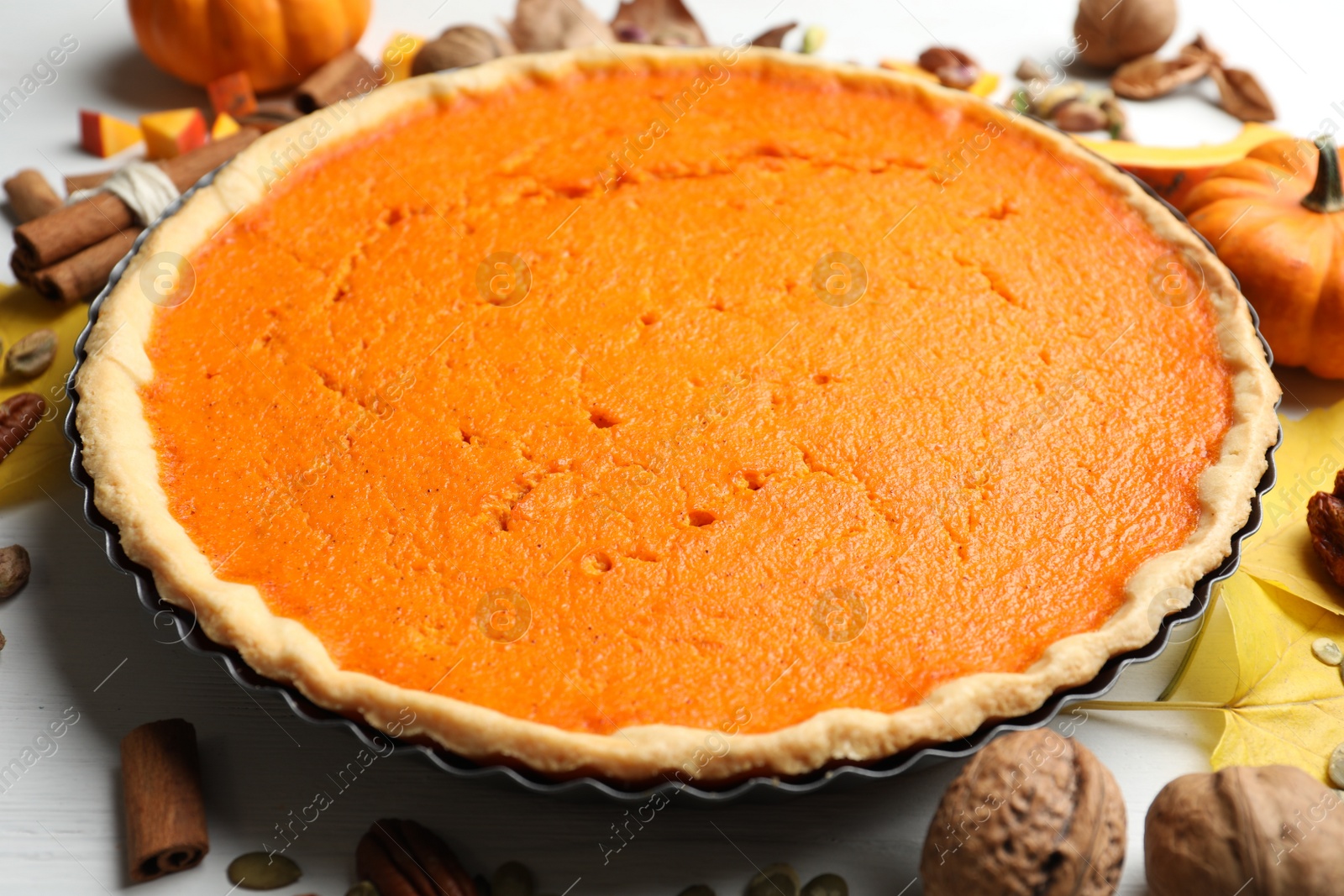 Photo of Delicious homemade pumpkin pie on wooden table