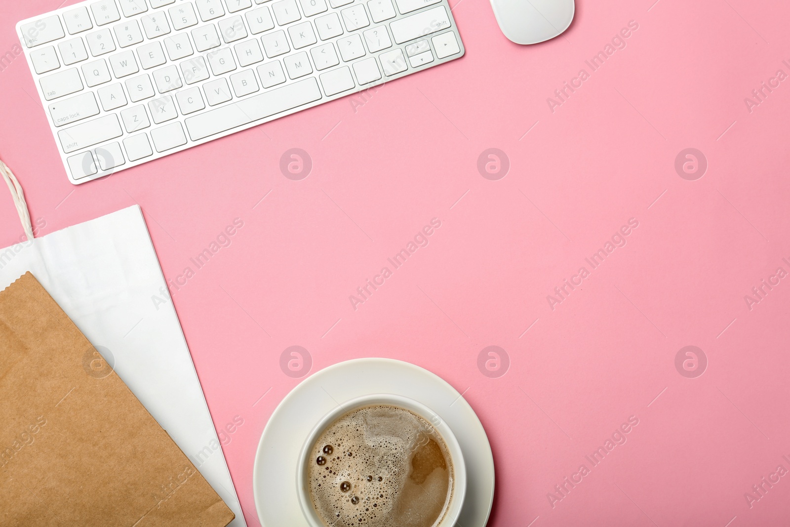 Photo of Stylish flat lay composition with shopping bag and cup of coffee on color background