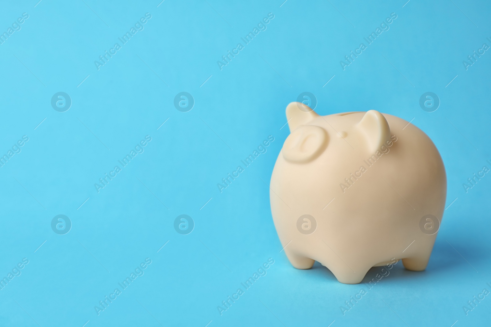 Photo of Cute piggy bank on color background. Money saving