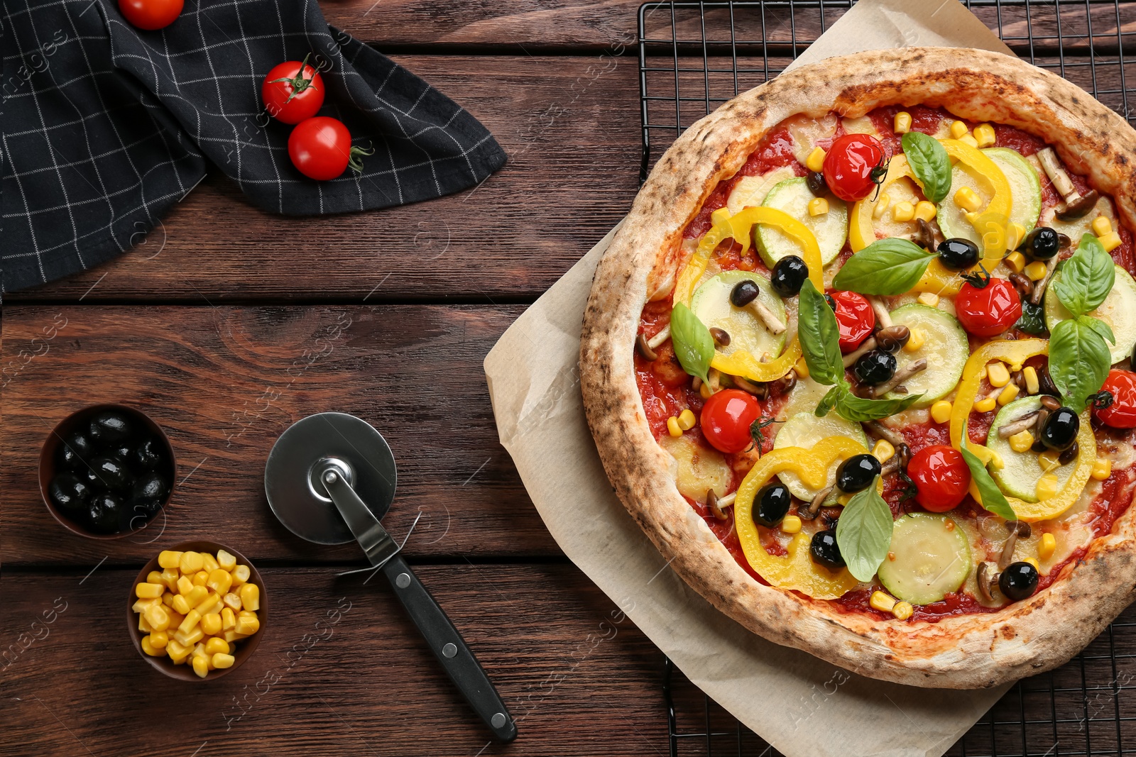 Photo of Flat lay composition with vegetable pizza on wooden table